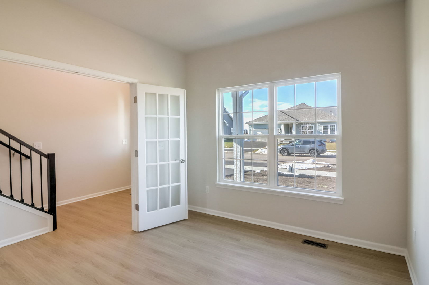 715 Maplewood Circle Elburn, IL 60119 - Photo 9 of 32 a view of an empty room with a window