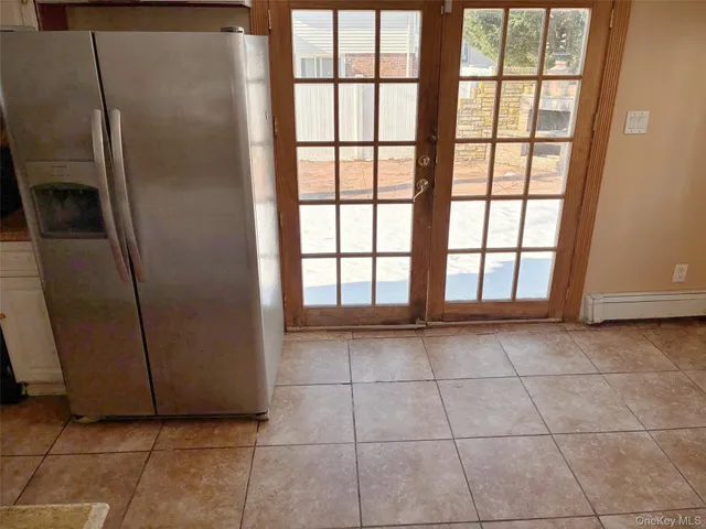 a bathroom with a toilet and a mirror