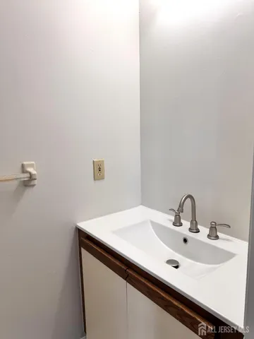 a close up of a sink and a mirror