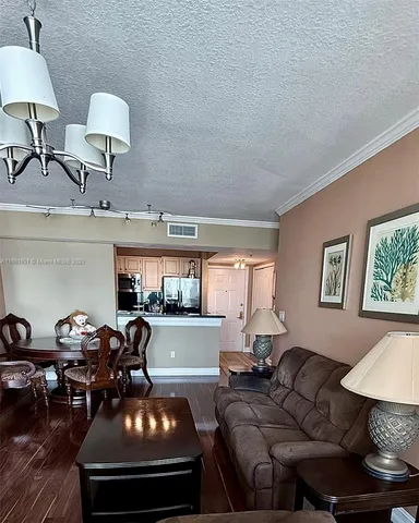 a living room with furniture and a lamp