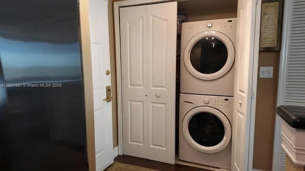 a view of a hallway with washer and dryer