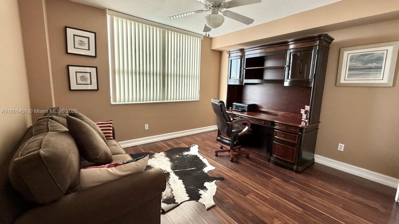 2665 Southwest 37th Avenue, Unit 1112 Miami, FL 33133 - Photo 24 of 31 a living room with furniture and a window