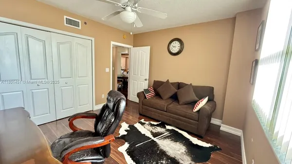 a living room with furniture and a window