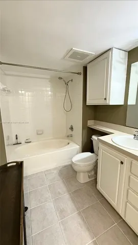 a bathroom with a bathtub sink and toilet