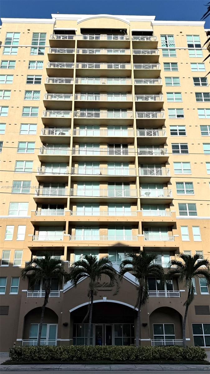 2665 Southwest 37th Avenue, Unit 1112 Miami, FL 33133 - Photo 31 of 31 a front view of a building with balcony