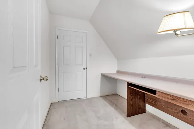 a view of storage and utility room with closet