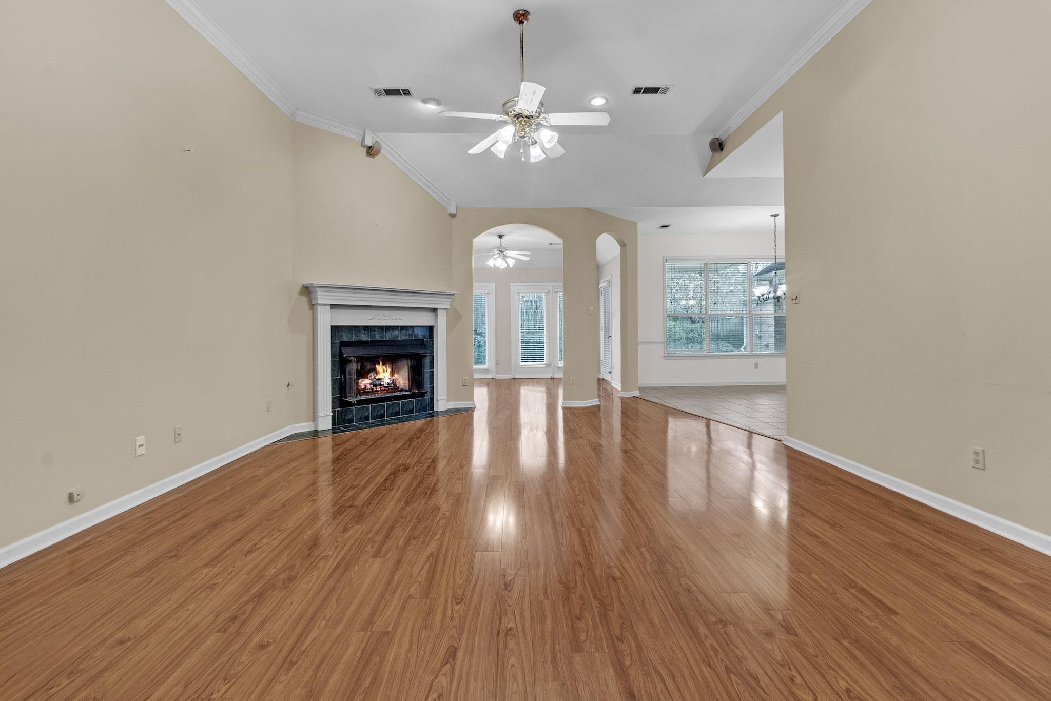 6307 Thistle Point Bartlett, TN 38135 - Photo 19 of 31 wooden floor in an empty room with a fireplace