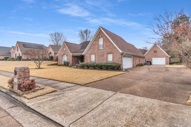 a house with yard in front of it