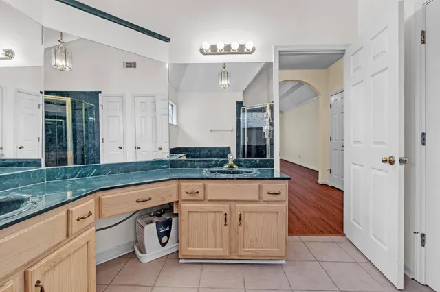 a view of a house with a yard next to a road