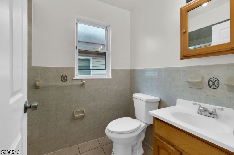 58 1st Street, Unit 3 Newark, NJ 07107 - Photo 16 of 19 a bathroom with a sink and a toilet