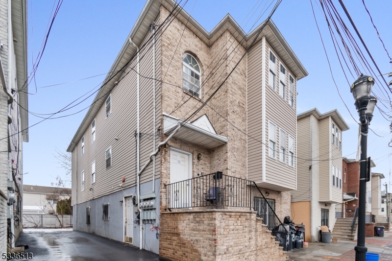 58 1st Street, Unit 3 Newark, NJ 07107 - Photo 19 of 19 a view of a house with a street