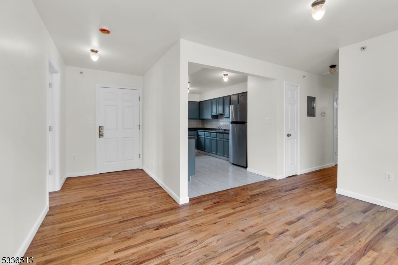58 1st Street, Unit 3 Newark, NJ 07107 - Photo 6 of 19 a view of a hallway with wooden floor