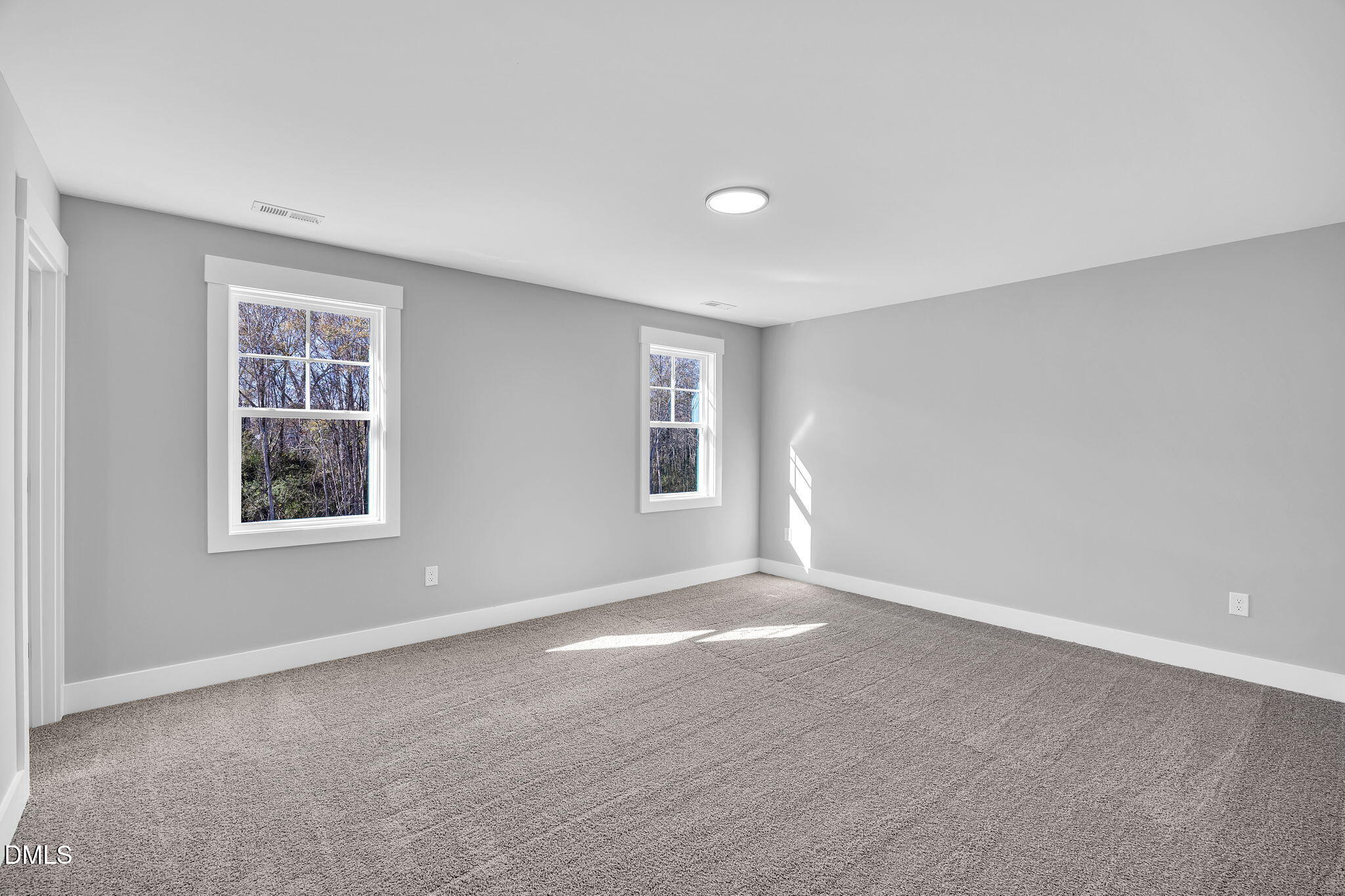 250 Freedom Ridge Drive Smithfield, NC 27577 - Photo 18 of 32 a view of an empty room with a window