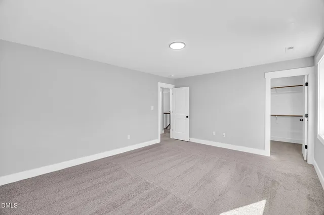 a view of a hallway with windows