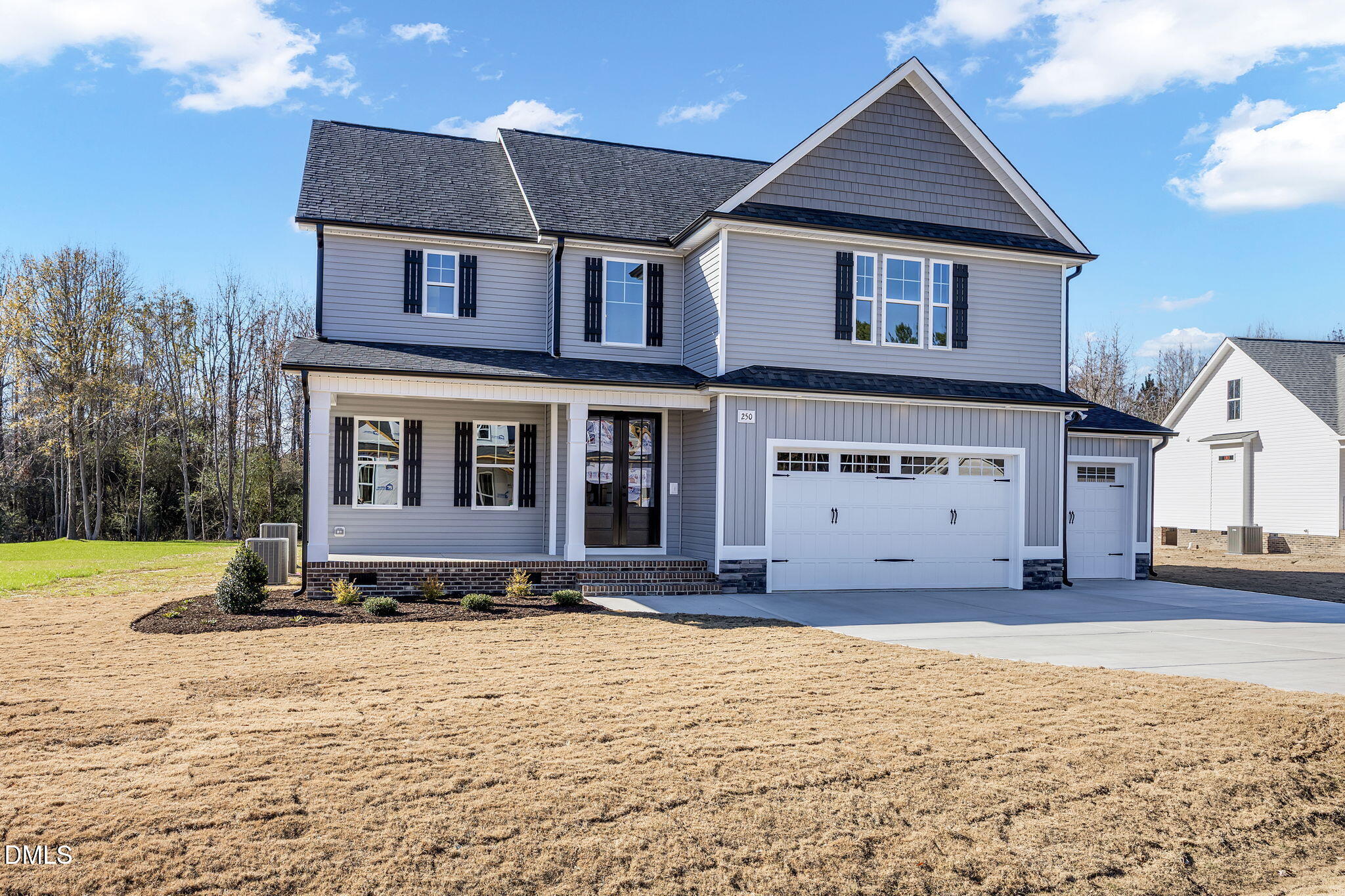 250 Freedom Ridge Drive Smithfield, NC 27577 - Photo 2 of 32 a front view of a house with a yard