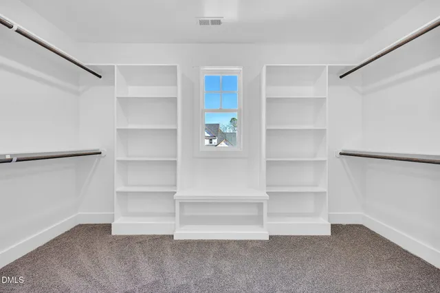 a bathroom with a sink a toilet a mirror and bathtub