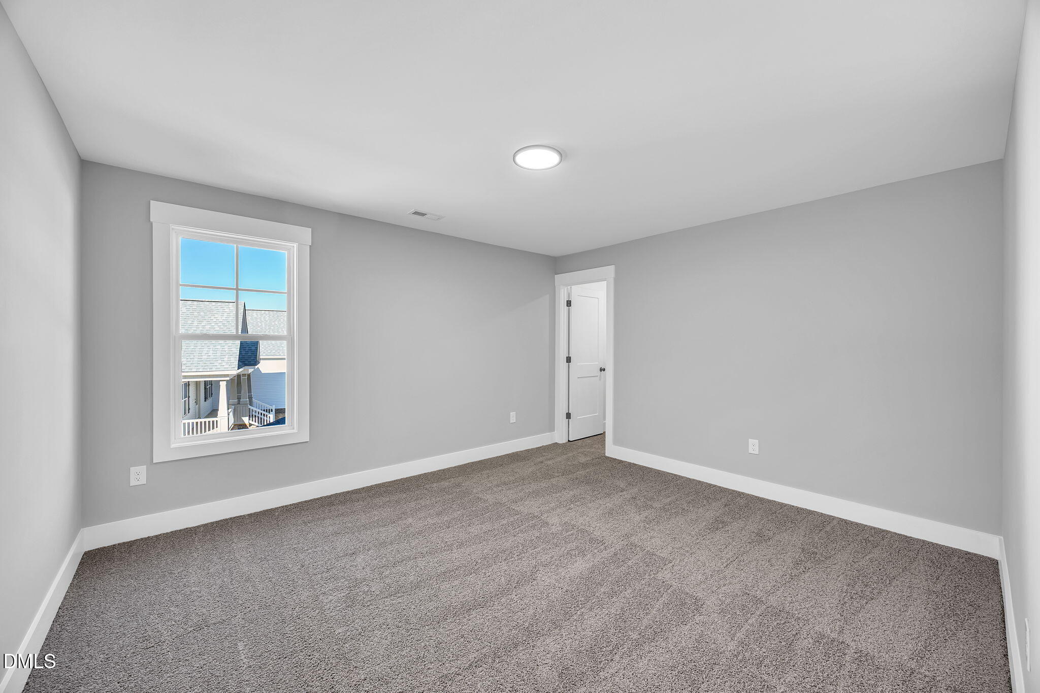 250 Freedom Ridge Drive Smithfield, NC 27577 - Photo 27 of 32 a view of an empty room with a window
