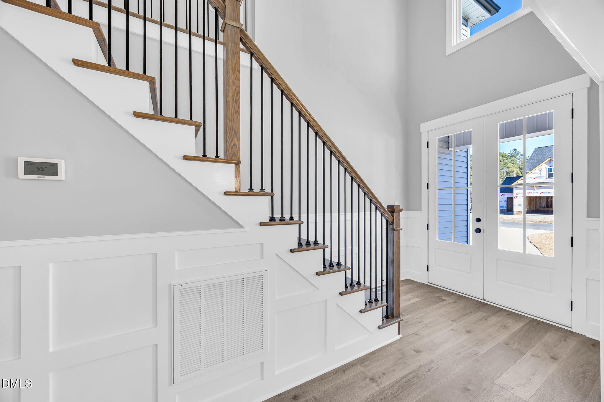 250 Freedom Ridge Drive Smithfield, NC 27577 - Photo 4 of 32 a view of staircase with railing and white walls