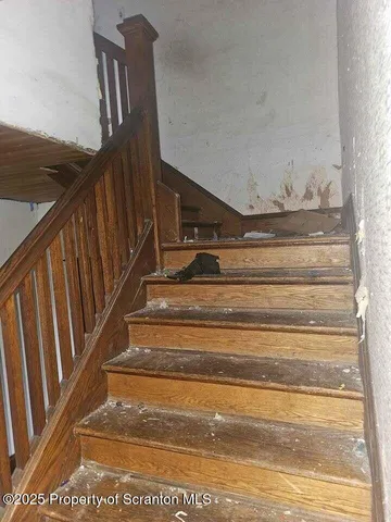 a view of a livingroom with furniture and a window