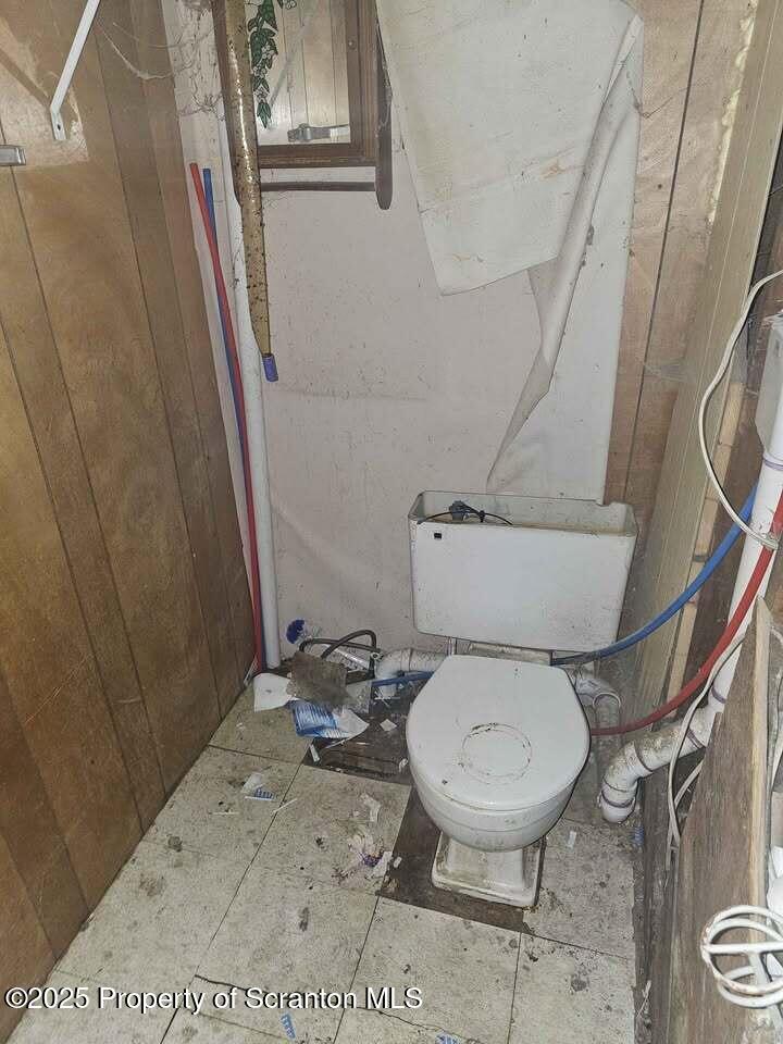 507 Delaware Street Forest City, PA 18421 - Photo 23 of 24 a bathroom with a toilet and a shower