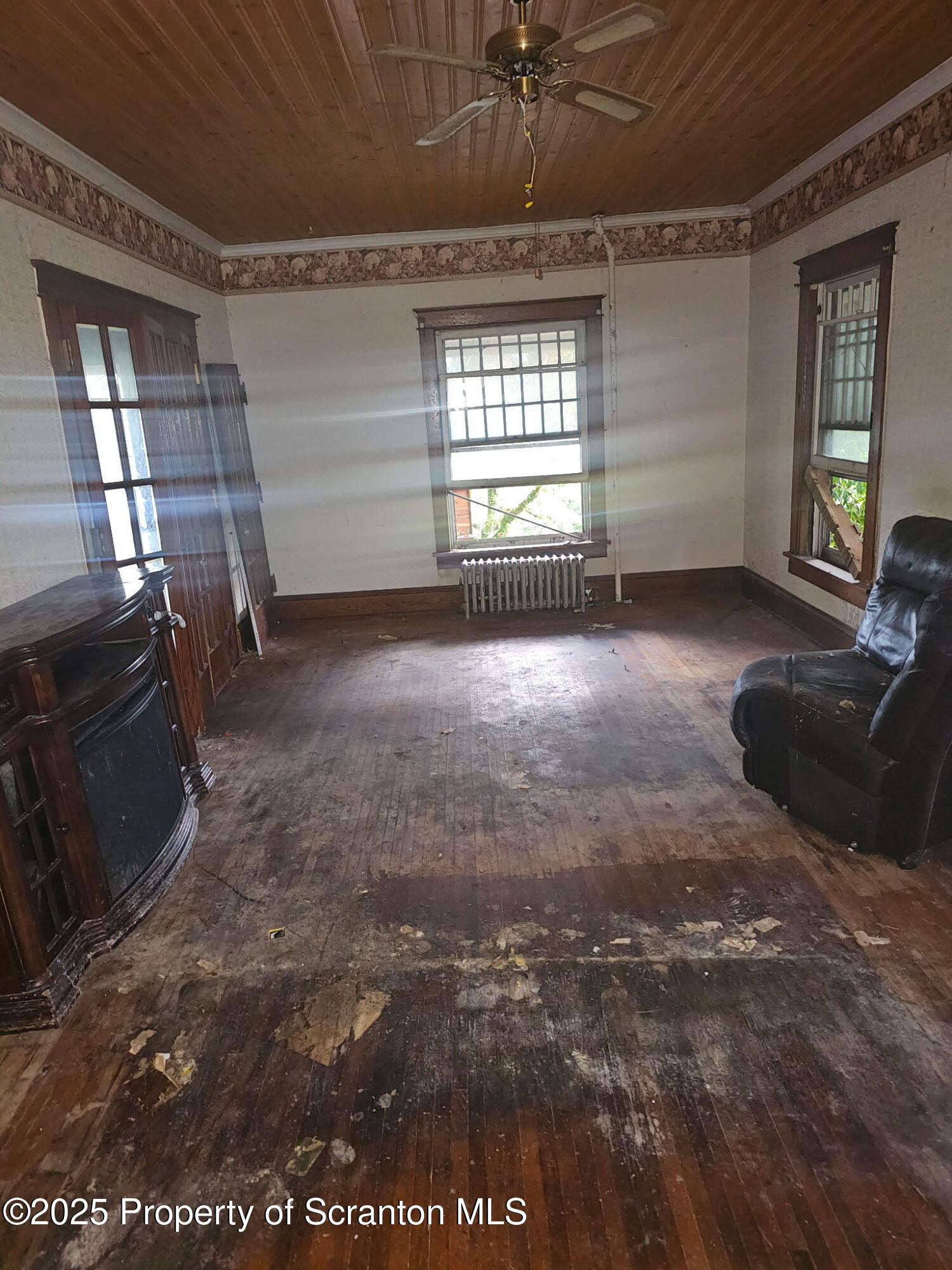 507 Delaware Street Forest City, PA 18421 - Photo 8 of 24 a view of an empty room with a window