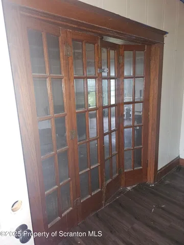 a view of entryway with wooden floor