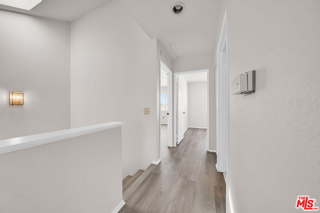 820 West Compton Boulevard, Unit 17 Compton, CA 90220 - Photo 33 of 50 a view of a hallway with wooden floor