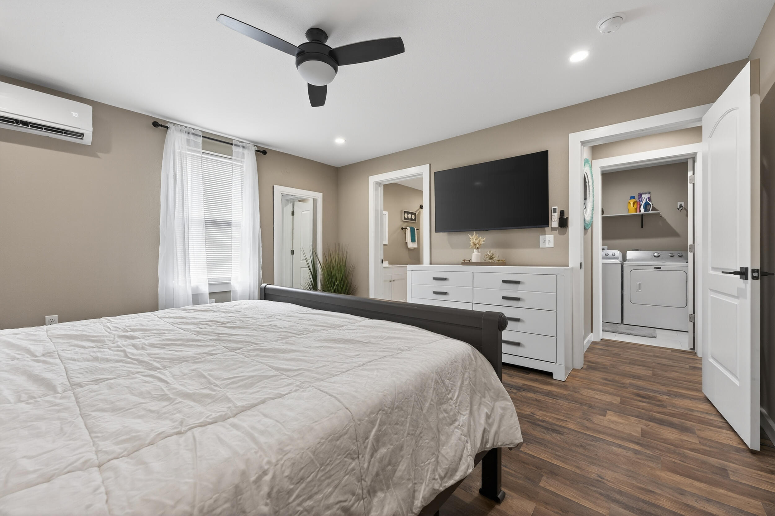 60 McDaniels Fishcamp Road, Unit A Freeport, FL 32439 - Photo 11 of 67 a bedroom with a bed and a flat screen tv