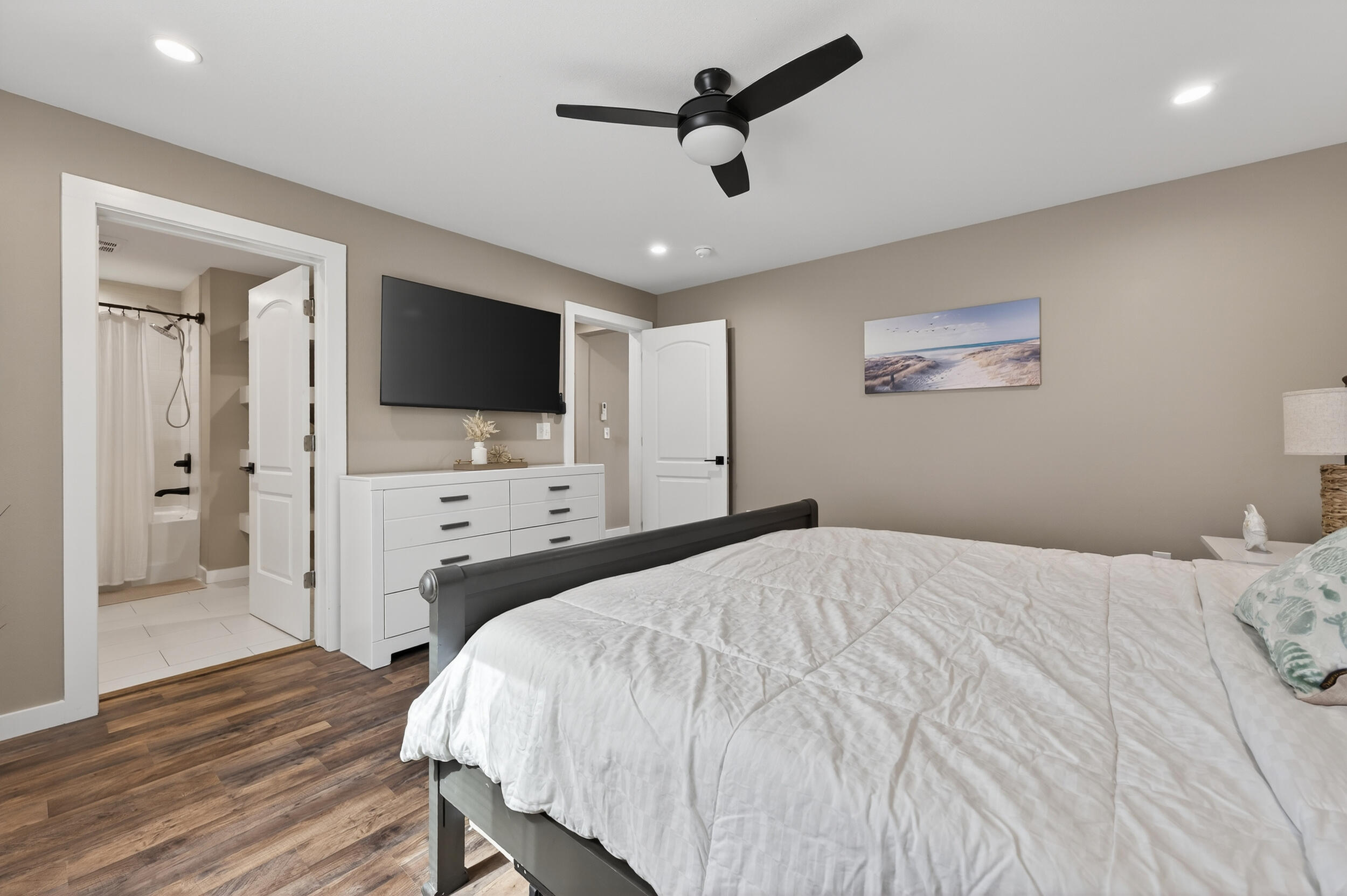 60 McDaniels Fishcamp Road, Unit A Freeport, FL 32439 - Photo 13 of 67 a bedroom with a bed and a flat screen tv