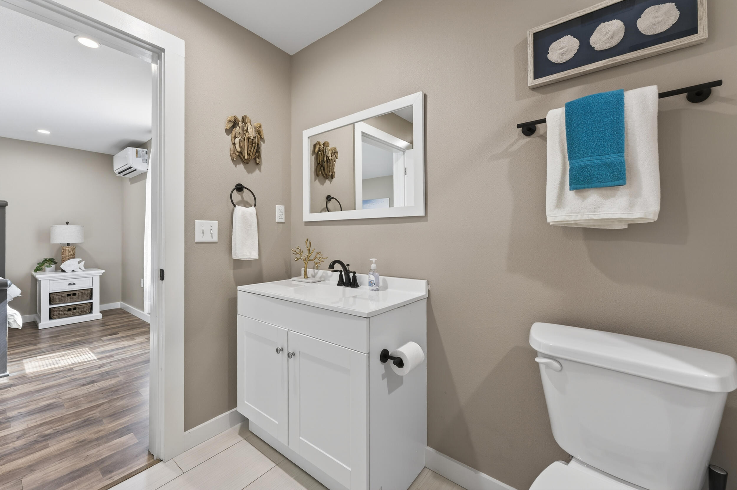 60 McDaniels Fishcamp Road, Unit A Freeport, FL 32439 - Photo 17 of 67 a bathroom with a toilet a sink and a mirror