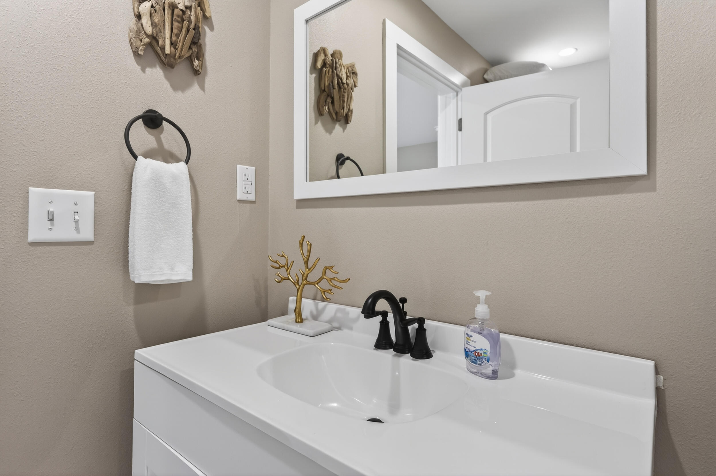 60 McDaniels Fishcamp Road, Unit A Freeport, FL 32439 - Photo 18 of 67 a bathroom with a sink and a mirror