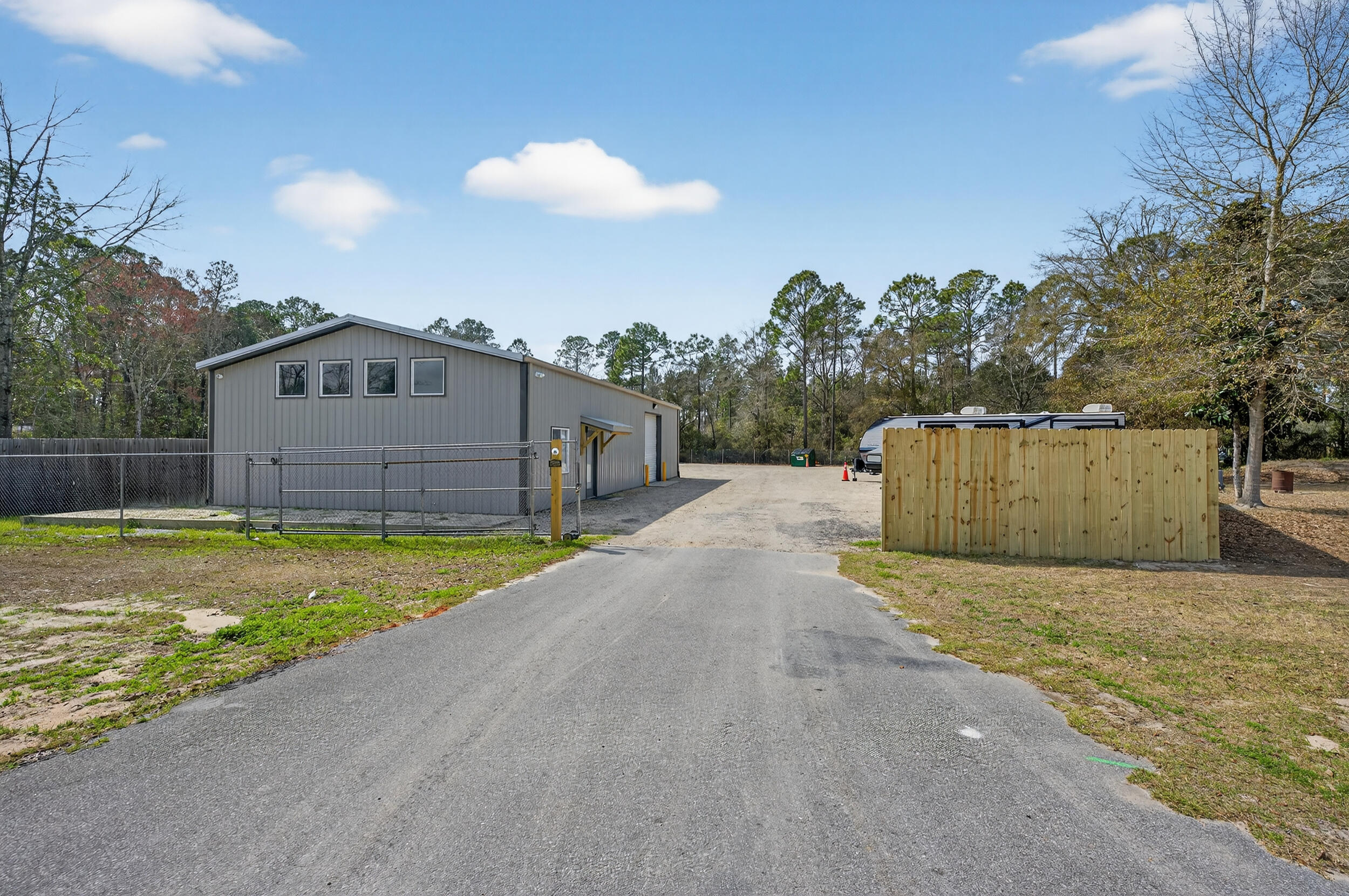 60 McDaniels Fishcamp Road, Unit A Freeport, FL 32439 - Photo 20 of 67 a view of a house with a yard and a large tree