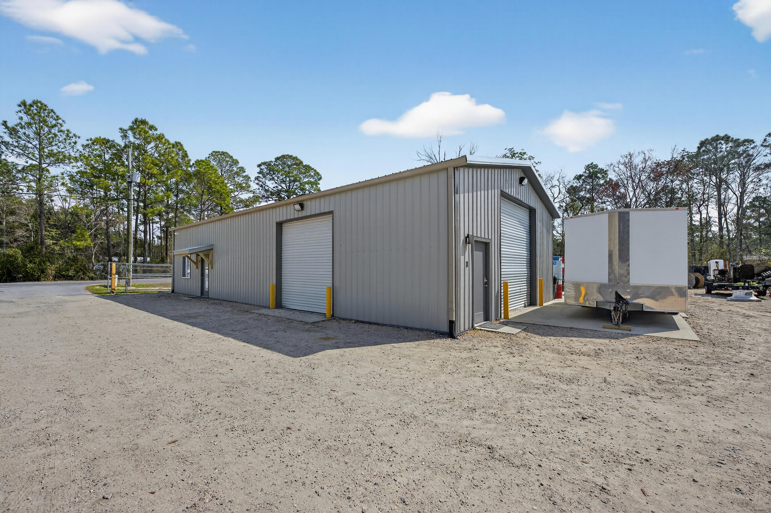 60 McDaniels Fishcamp Road, Unit A Freeport, FL 32439 - Photo 27 of 67 a view of a house with a yard and garage