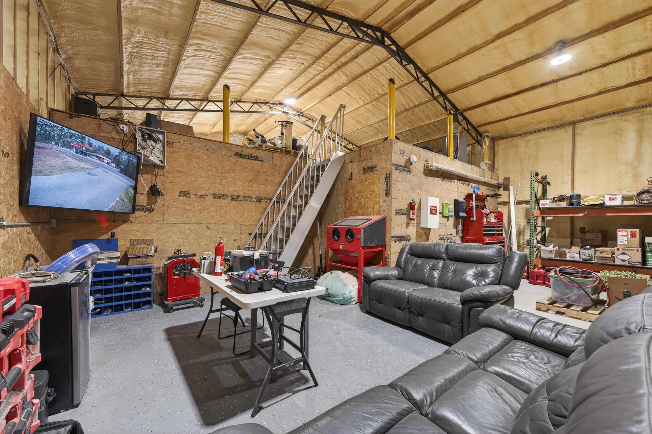 60 McDaniels Fishcamp Road, Unit A Freeport, FL 32439 - Photo 30 of 67 a living room with furniture and a flat screen tv