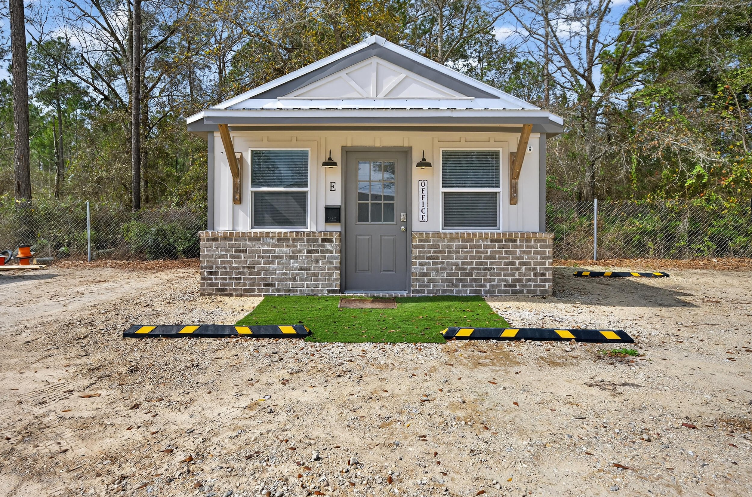 60 McDaniels Fishcamp Road, Unit A Freeport, FL 32439 - Photo 33 of 67 a front view of a house with garden