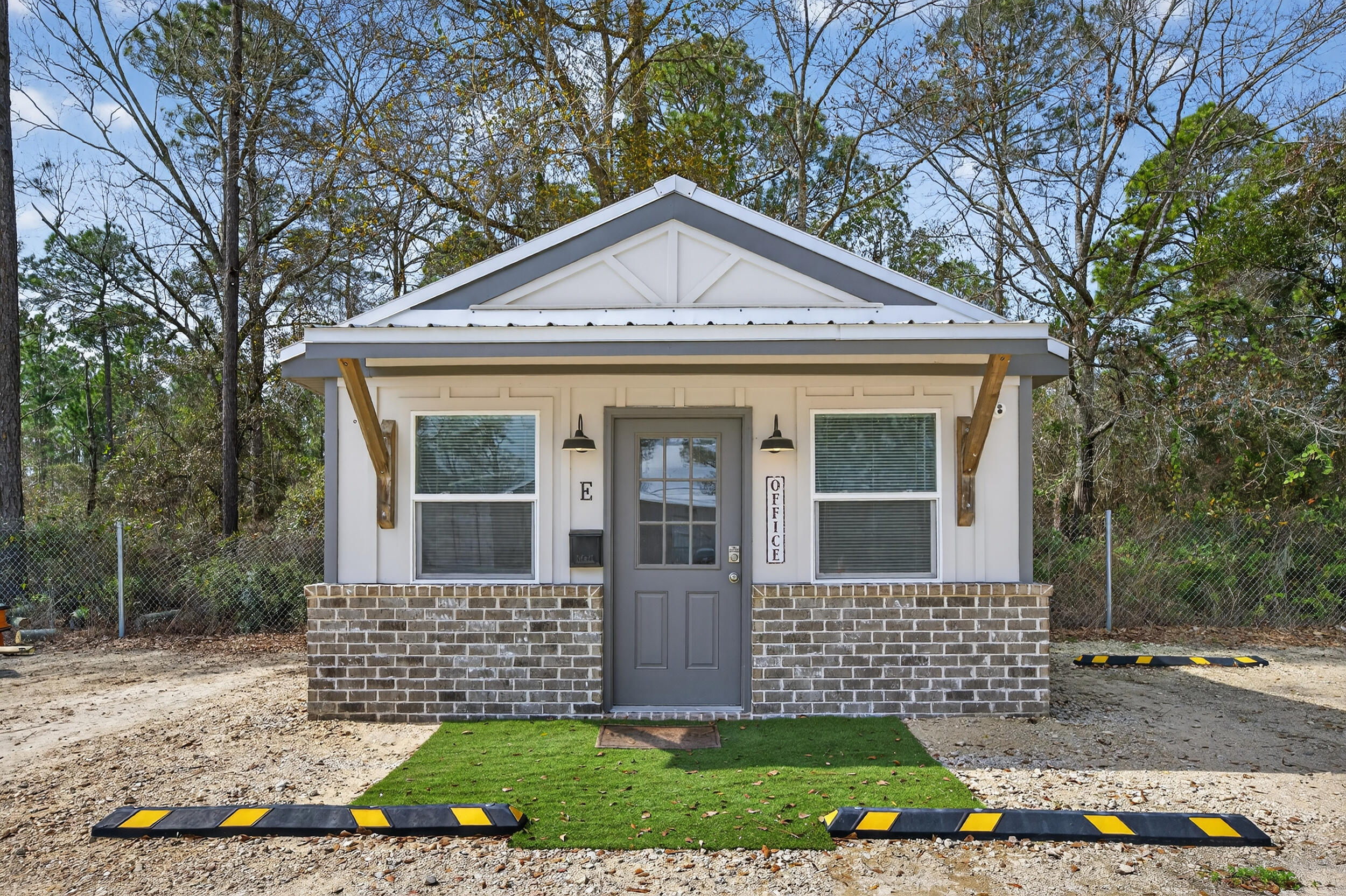 60 McDaniels Fishcamp Road, Unit A Freeport, FL 32439 - Photo 34 of 67 a front view of a house with a yard