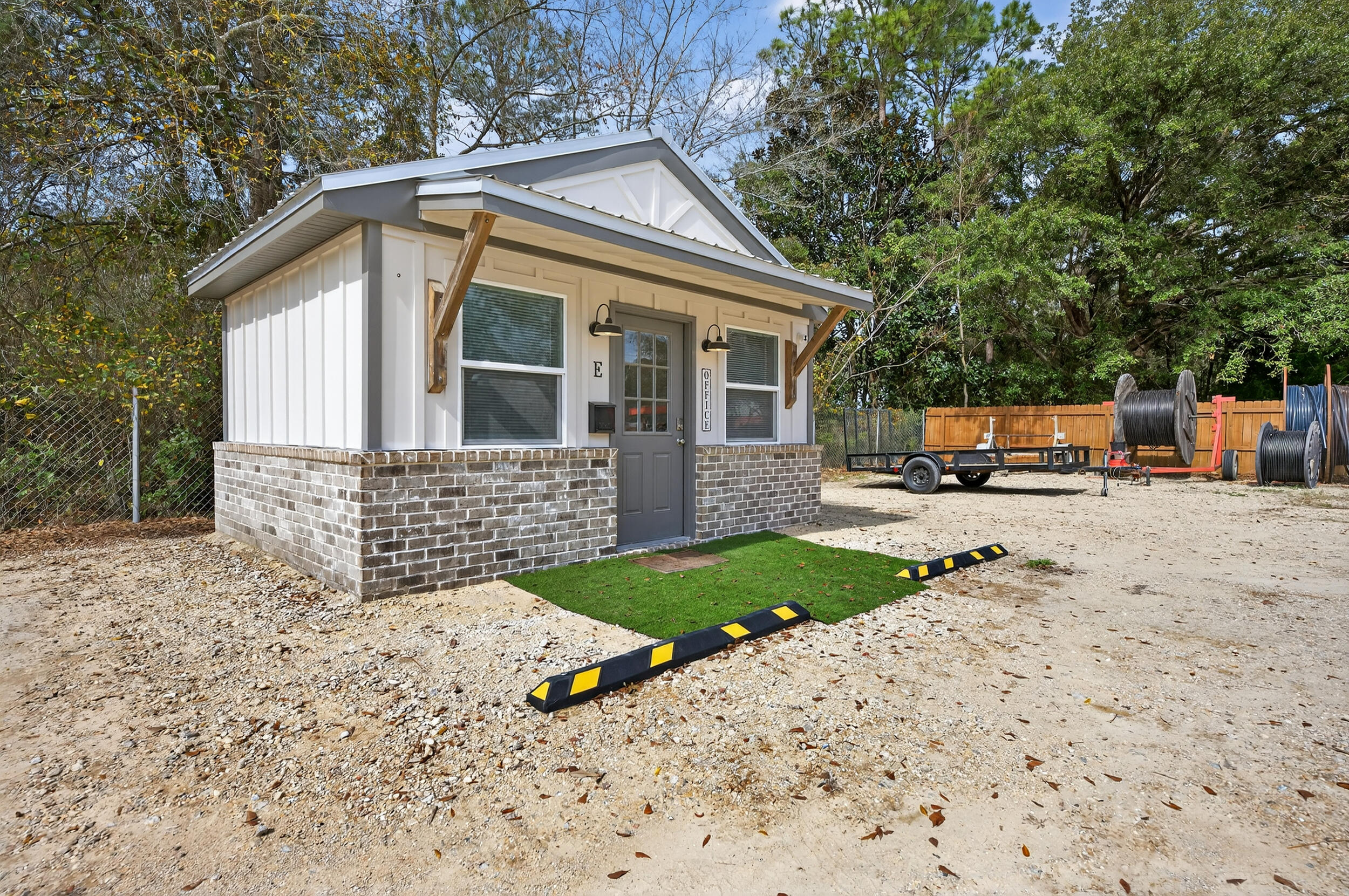 60 McDaniels Fishcamp Road, Unit A Freeport, FL 32439 - Photo 35 of 67 a view of a house with a yard and large tree