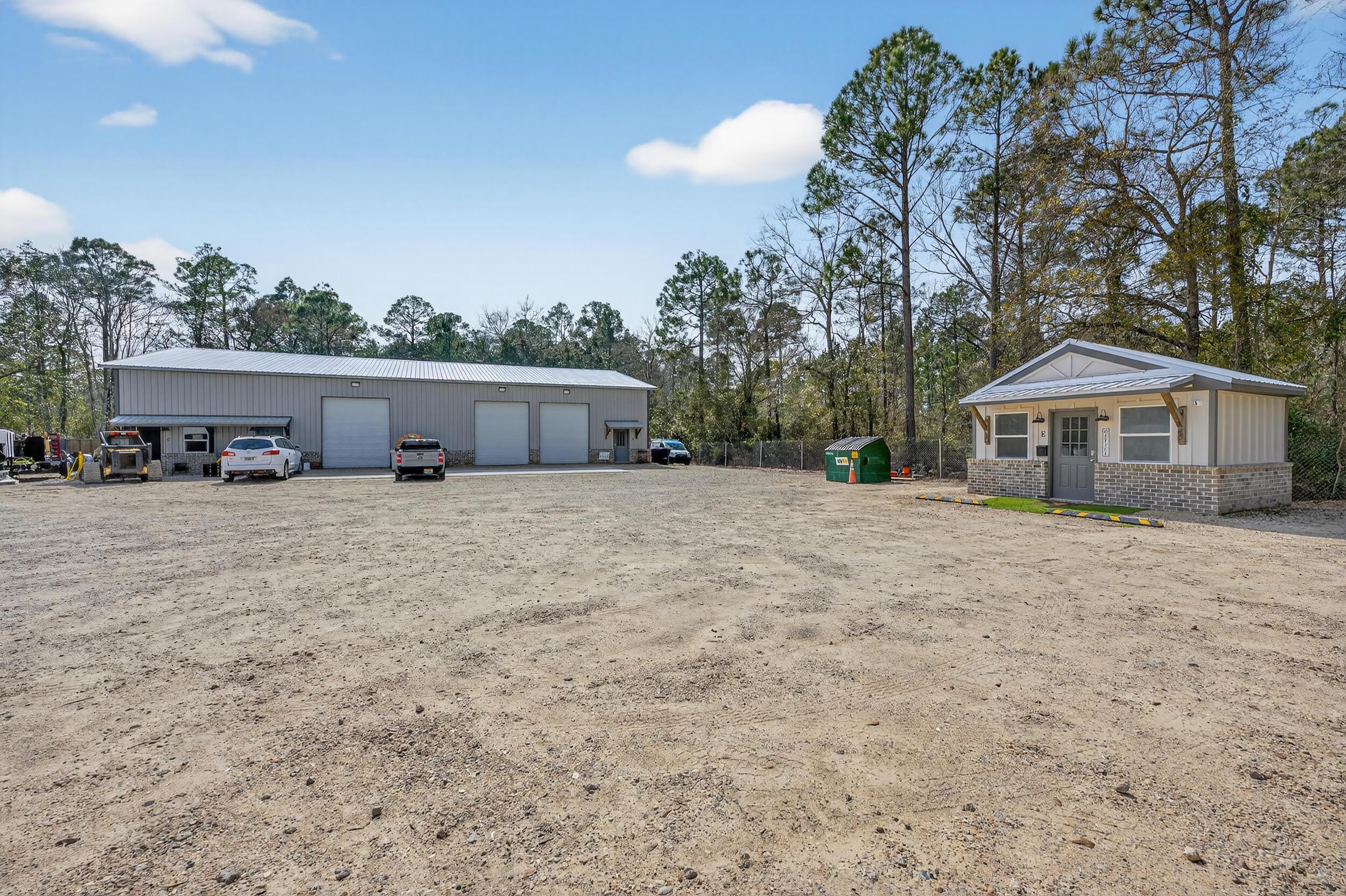 60 McDaniels Fishcamp Road, Unit A Freeport, FL 32439 - Photo 39 of 67 a front view of a house with a yard and garage