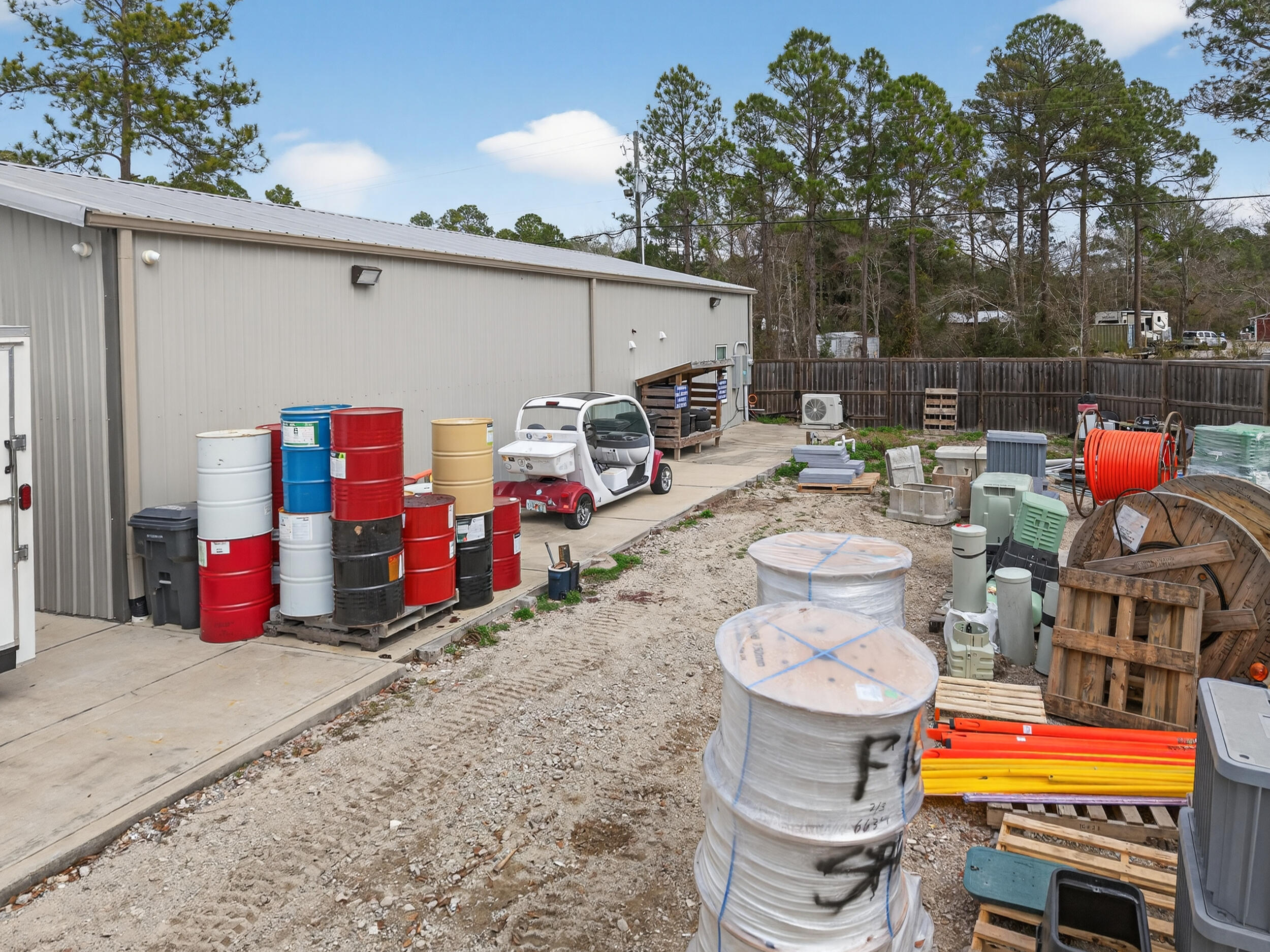 60 McDaniels Fishcamp Road, Unit A Freeport, FL 32439 - Photo 51 of 67 a backyard of a house with barbeque oven table and chairs