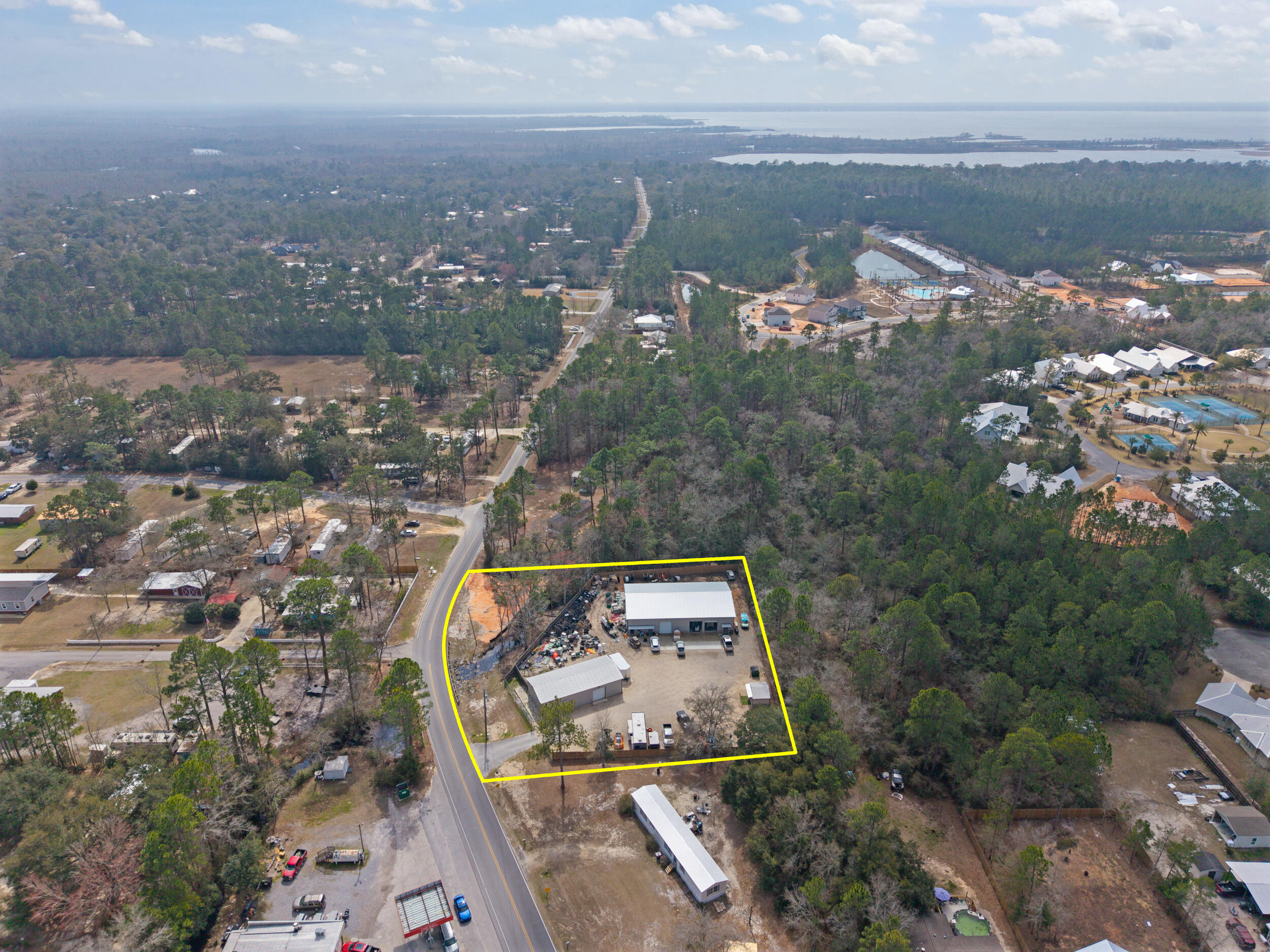 60 McDaniels Fishcamp Road, Unit A Freeport, FL 32439 - Photo 58 of 67 an aerial view of a house with a lake view