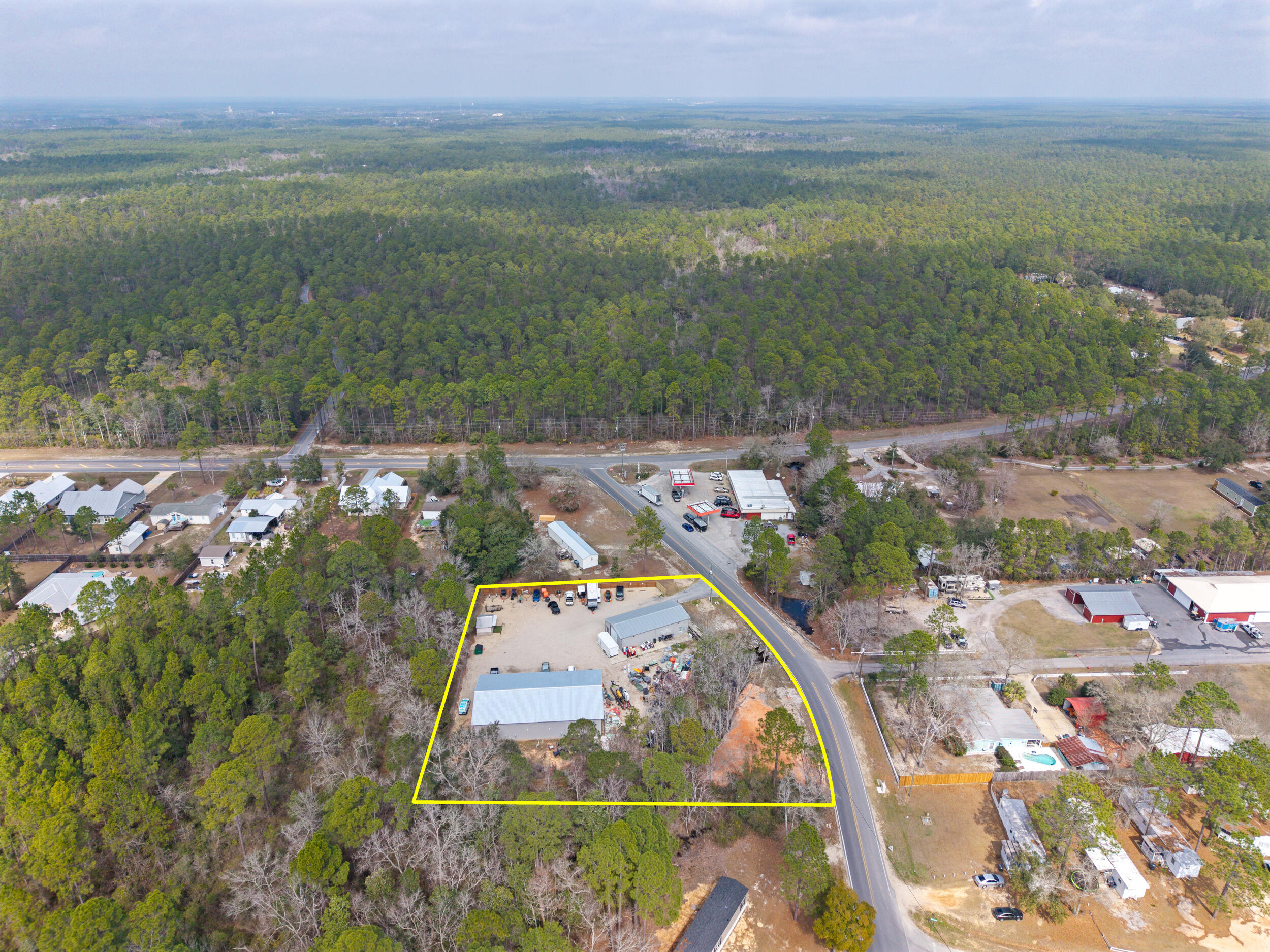 60 McDaniels Fishcamp Road, Unit A Freeport, FL 32439 - Photo 61 of 67 an aerial view of a house with a lake view