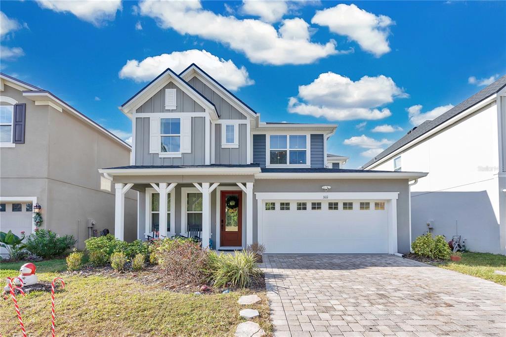 3111 Stonegate Drive Ocoee, FL 34761 - Photo 1 of 1 a view of a house with a yard and potted plants