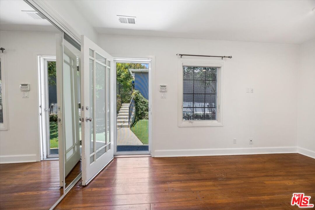 14041 Roblar Road Sherman Oaks, CA 91423 - Photo 31 of 47 a view of an entryway with wooden floor and door