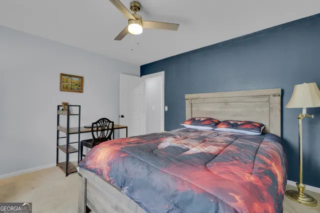 a bed room with a bed and a window