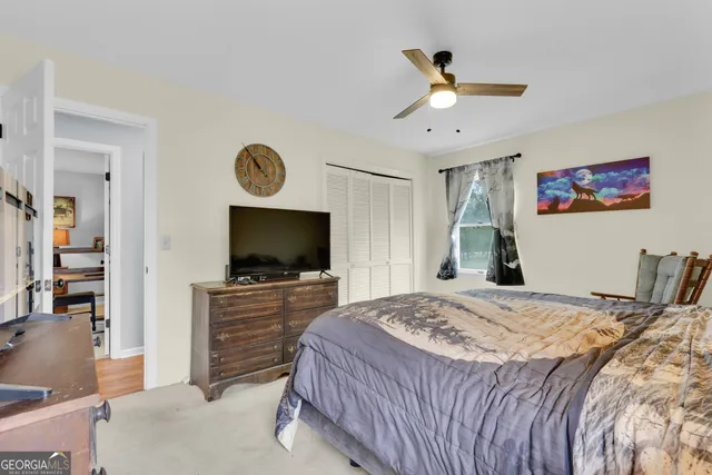 a bathroom with a sink toilet and mirror
