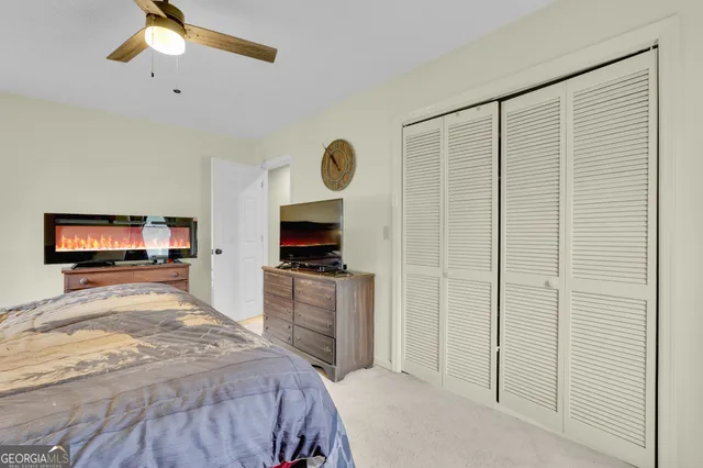 a bathroom with a sink a toilet and a window