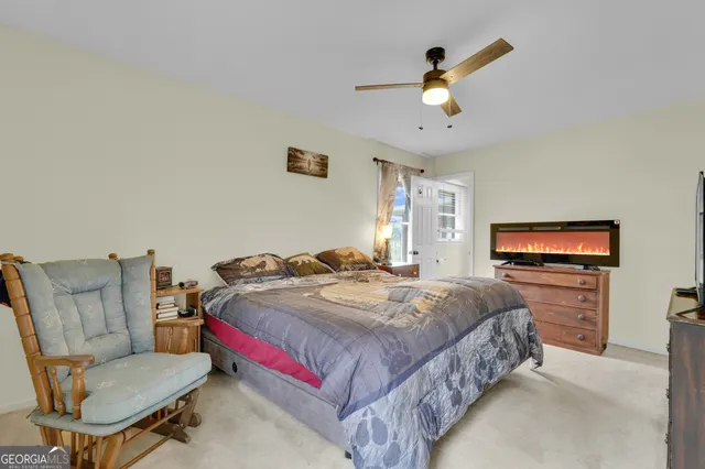a bathroom with a sink a toilet and a window