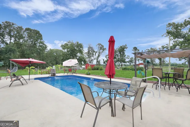 a front view of house with yard outdoor seating and green space
