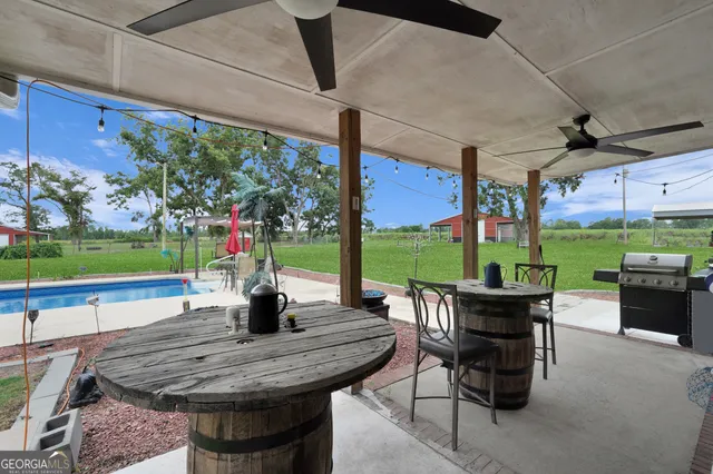 a front view of house with yard and outdoor seating