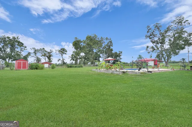 a view of a lake with a yard